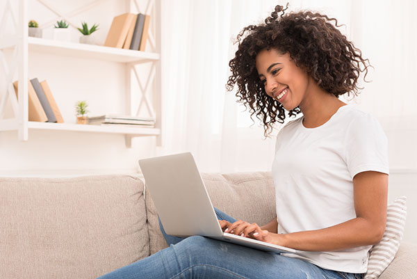 Adult woman on laptop from home for telehealth appointment